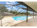 Beautiful screened-in pool area with ample deck space for outdoor entertaining at 820 Lamp Post Ln, Lakeland, FL 33809