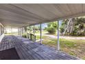 Spacious screened-in porch with wood flooring and outdoor view at 4844 Creek Meadow Trl, Lakeland, FL 33810