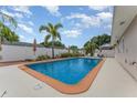 Inviting backyard pool with a well-kept deck and beautiful landscaping at 1545 Sailpoint Dr, Bartow, FL 33830