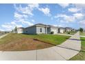 A cozy one-story home featuring well-maintained lawns and a two-car garage at 1336 Madison Cir, Haines City, FL 33844