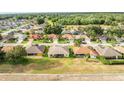 Aerial view showcasing the community, lush greenery, and mature trees at 2522 Pine Valley Dr, Lakeland, FL 33810
