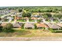A neighborhood aerial shot reveals tree lined streets and well-maintained homes at 2522 Pine Valley Dr, Lakeland, FL 33810