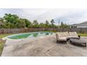 Relaxing backyard with a refreshing in-ground pool and comfortable outdoor seating at 14791 Sw 29Th Avenue Rd, Ocala, FL 34473