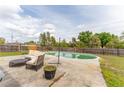 Private backyard with an inviting in-ground pool and comfortable patio seating area at 14791 Sw 29Th Avenue Rd, Ocala, FL 34473