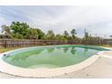 Inviting in-ground pool with a clean, spacious concrete deck for lounging and entertaining at 14791 Sw 29Th Avenue Rd, Ocala, FL 34473