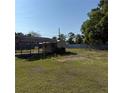 Large backyard with covered parking and storage shed, perfect for outdoor activities and storage solutions at 3640 Chart Prine Rd, Lakeland, FL 33810