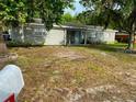 Charming single-story home with mature trees in a well-maintained front yard at 4707 Melody Ln, Lakeland, FL 33805