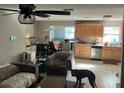 An open-concept layout showcasing the living room, kitchen, and dining area at 4707 Melody Ln, Lakeland, FL 33805