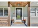 Inviting front door with decorative glass panel and a 'Stay awhile' welcome mat at 5811 Lake Breeze Ave, Lakeland, FL 33809