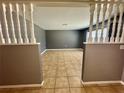 Spacious living room showcasing neutral tile floors and ample natural light at 4621 Queens Point Drive, Lakeland, FL 33813