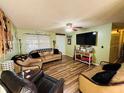 Comfortable living room with wood floors and bright natural light at 4746 Wales St, Lake Wales, FL 33859
