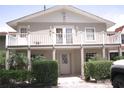 A charming home exterior with a white balcony, well-maintained landscaping, and ample curb appeal at 201 Lake Bonny E Dr, Lakeland, FL 33801