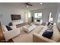 Bright living room features modern decor, white furniture, and hardwood floors at 3632 Mockingbird Ln, Orlando, FL 32803