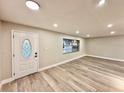 Spacious living room featuring modern flooring, fresh paint, and ample natural light at 1968 Pleasant Hill Rd, Kissimmee, FL 34746