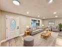 Bright living room with a modern design, neutral colors, and ample seating at 1968 Pleasant Hill Rd, Kissimmee, FL 34746