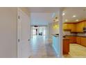 Spacious living room with tiled floors, fireplace, bar and open floor plan to the kitchen at 2305 Edgewater Dr # 1606, Orlando, FL 32804