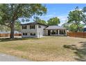 Two-story home with a well-manicured lawn and a metal roof under a sunny sky at 1352 Charlotte St, Altamonte Springs, FL 32701