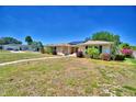 Lovely single-story home with solar panels, well-maintained landscaping, and a welcoming atmosphere at 53 Paine Dr, Winter Haven, FL 33884