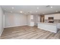 Open concept living space featuring bright white walls and modern floors at 6784 Sw 90Th Loop, Ocala, FL 34476