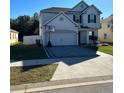 Charming two-story home with a paver driveway and basketball hoop at 2121 Amor Way, Leesburg, FL 34748