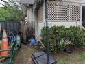 Side view of a house, showcasing a yard with outdoor items and features at 1529 Indiana St, Orlando, FL 32805