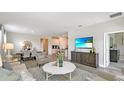 Bright and airy living room with dining area, hardwood floors, and open layout at 4662 Coral Harbour Rd, Kissimmee, FL 34758
