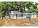 A cozy single-Gathering home featuring a well-kept yard and classic suburban charm, showcasing a relaxed living environment at 1480 E Davidson St, Bartow, FL 33830