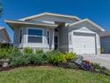 This charming single-story home features manicured landscaping and an attached one-car garage at 6229 Raven Run, Lakeland, FL 33809