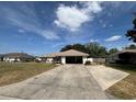 Charming single-story home with spacious driveway and well-maintained lawn at 3210 Se 54Th Cir, Ocala, FL 34480