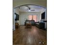 Open concept living area with hardwood flooring, natural light, and neutral wall color at 1710 Hamilton St, Bartow, FL 33830