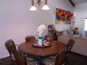 Warm dining room featuring a round table set for six, with artful decor at 5225 Imperial Lakes Blvd # 52, Mulberry, FL 33860