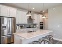 Modern kitchen featuring stainless steel appliances, a large island, and white cabinets at 5832 Sw 87Th Ave, Ocala, FL 34481