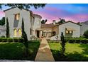 Beautiful two-story home with landscaped front yard and a tranquil evening sky at 1239 Roycroft Ave, Kissimmee, FL 34747