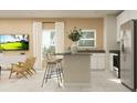 Open-concept living room and kitchen area with bright natural light and island seating at 7244 Summer Ivy Aly, Orlando, FL 32829