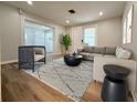 Cozy living room with stylish furniture, neutral tones, and hardwood flooring offers a great space to relax at 1505 Piedmont Dr, Deltona, FL 32725
