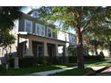 Charming two-story home featuring a welcoming front porch and well-manicured landscaping at 11578 Ashlin Park Blvd, Windermere, FL 34786