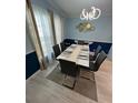 Stylish dining room showcasing a modern table, elegant chairs, and unique lighting at 118 Jana Cir, Auburndale, FL 33823
