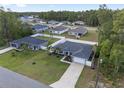 Aerial view of a neighborhood featuring single Gathering homes with well-manicured lawns at 6873 Sw 131St Pl, Ocala, FL 34473