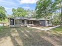 A view of the home's facade, featuring a well-maintained lawn and inviting walkway at 5434 Se 39Th Ave, Ocala, FL 34480