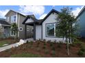 Stylish single-Gathering home exterior with modern design and manicured landscaping at 3102 Voyager Ave, St Cloud, FL 34771