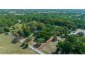 Expansive property surrounded by lush greenery, bordered by a vibrant red line at 7795 Sw 72Nd Ct, Ocala, FL 34476