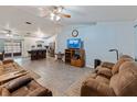 Open concept living room featuring plenty of space and open access to the kitchen at 7040 Tamarind Dr, Lake Wales, FL 33898