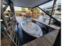 Covered boat dock with boat lift providing easy access to the open water at 166 Catfish St, Haines City, FL 33844