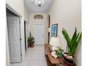 Bright foyer with tile flooring, chandelier, and decorative accents at 4662 Harts Brook Ln, Mulberry, FL 33860