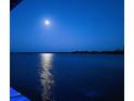Beautiful lake view reflecting the moon on a clear night with horizon in the distance at 1395 S Lake Reedy Blvd, Frostproof, FL 33843