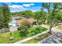 Ariel view of a charming home with a private pool and well-maintained landscaping at 1604 Nottingham Dr, Winter Park, FL 32792