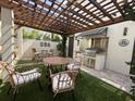 Inviting outdoor kitchen with pergola, stainless steel appliances, and ample seating for entertaining at 1056 Castle Pines Ct, Reunion, FL 34747