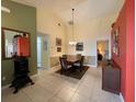 Cozy dining room with tile floors, neutral walls, and a wooden table set for four at 313 Morning Creek Cir, Apopka, FL 32712