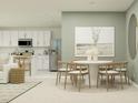 A combined kitchen and dining area featuring a round dining table and coordinated decor at 2442 Mckinley Dr, Lake Wales, FL 33859