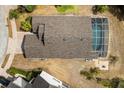 Aerial view of a single-Gathering home with a screened in pool and a well-manicured lawn at 547 Windsor Pl, Davenport, FL 33896